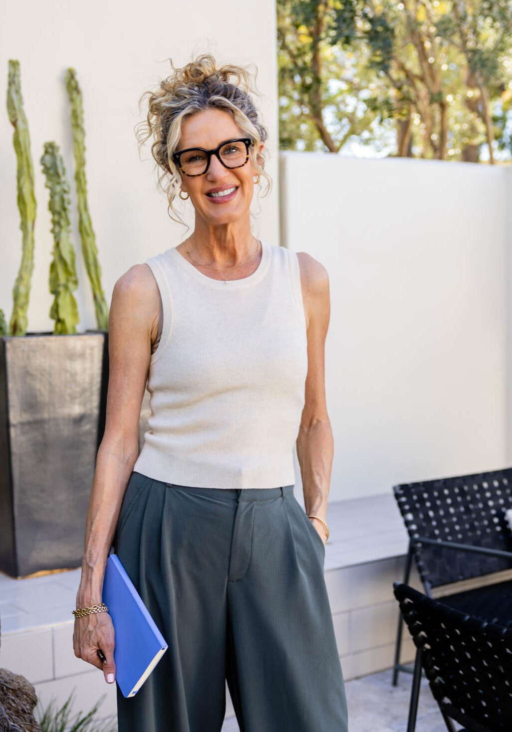 happy and healthy woman in midlife while enjoying outdoor living and journal writing
